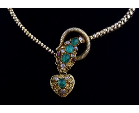 Victorian gold snake necklace, set with cabochon cut emeralds and  old cut diamonds,  cabochon ruby eyes, holding heart penda