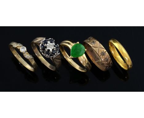 Five gold rings, including a 22ct gold wedding ring, ring size K,14ct gold jade ring, ring size O, sapphire and diamond clust