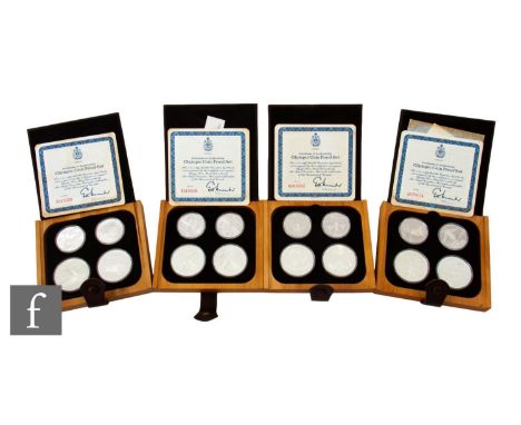 AMENDED DESCRIPTION Elizabeth II - Four Canadian Olympics 1976 ten and five dollar silver proof coin sets, 67g, each in a fau