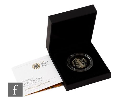 Elizabeth II - A 2009 Kew Gardens silver proof fifty pence coin, certificate and cased. Condition reports for all lots are av