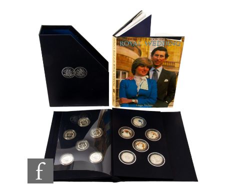 Elizabeth II - A 1981 Royal Wedding twelve silver proof coin set in folder and slip case and a Debrett's book of the Royal We
