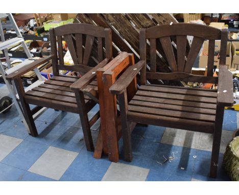 A Circular Garden Table and Two Chairs 