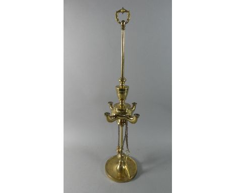 An Indian Brass Rise and Fall Temple Lamp with Chained Snuffers, Four Branch, 61cm high 