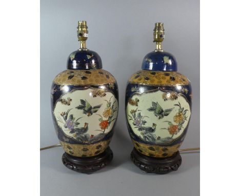 A Pair of Oriental Ceramic Table Lamps on Pierced Wooden Stands, 43cm High 