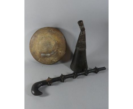 A Collection of Three Tribal Artifacts to include Oriental Circular Drum, and African Carved Rain Stick and a Carved Wooden W