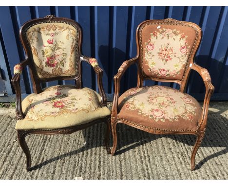 Two early to mid 20th Century stained beech framed elbow chairs in the Louis XV taste with floral needlework upholstered back