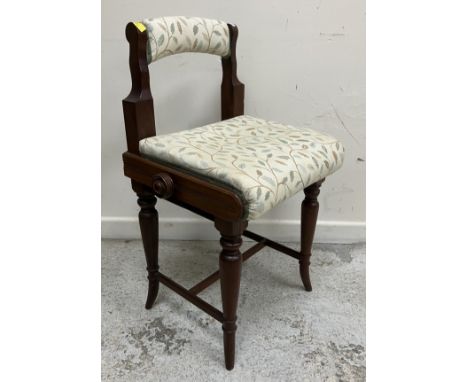 A late Victorian walnut framed 'Windsor Premier' piano/music stool with upholstered back rail and adjustable seat on turned l