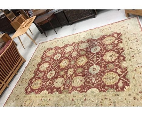 A Ziegler designed Chobie carpet, the central panel set with red ground and all-over foliate decoration, within a stepped cre