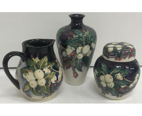 A Moorcroft "Snowberry" pattern baluster sparrow beak jug, bearing impressed marks and signed "Emma Bosson" and dated "28th M