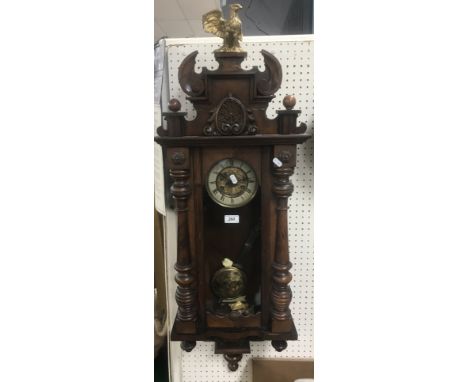 A late 19th Century walnut cased Vienna regulator wall clock, 38 cm wide x 105 cm high