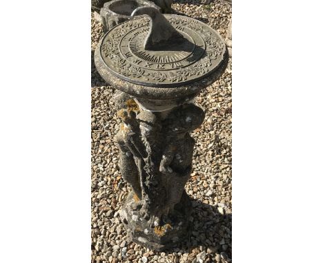 A concrete sundial as the three graces supporting the sundial on their heads, 80 cm high
