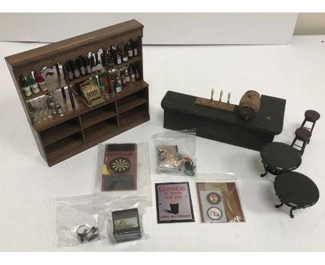 A collection of various doll's house pub paraphernalia by Miniature Display Co., Chapel Road Miniatures and John Watkins vari