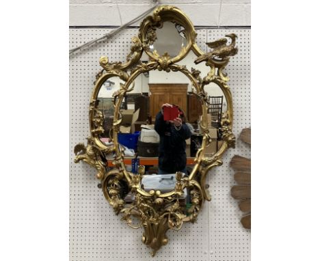 An early 19th Century giltwood and gesso framed multi-plate girandole mirror in the Chinese Chippendale taste, with Ho Ho bir