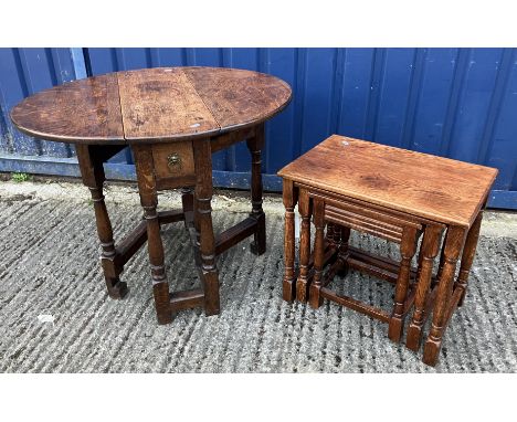 A 19th Century oak tea table in the 17th Century manner, the oval drop-leaf top on a turned gate-leg base, 71 cm wide x 80 cm