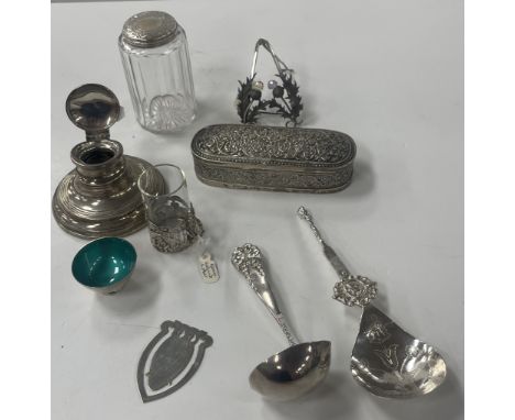 A collection of silver and white metal items to include a small silver capstan inkwell, a small bowl with enamelled interior 