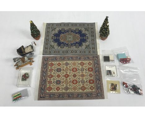 A collection of various doll's house accessories to include two Persian silk carpets, a collection of nursery items including