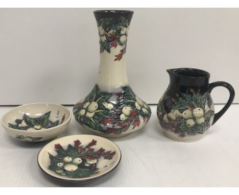 A Moorcroft "Snowberry" pattern baluster sparrow beak jug, bearing impressed marks and signed "Nicola Slaney" to base, bearin