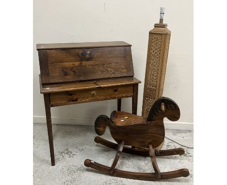A 20th Century stained pine bureau, the sloping fall enclosing a basic fitted interior over a single drawer on square chamfer