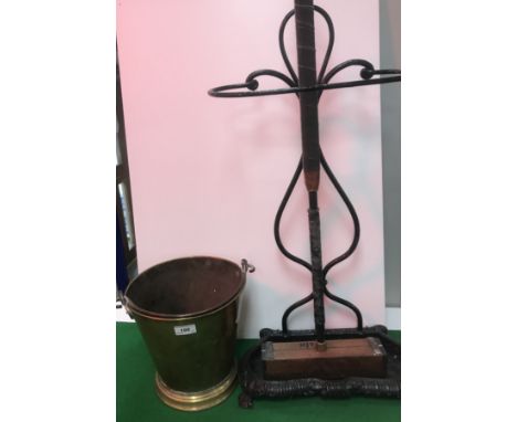 A brass bucket of slightly tapered form on a flared foot, stamped with maker's mark "SWJ" over a Swastika (for Sicher Wie Jol