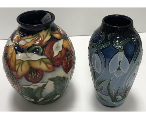 A Moorcroft "Christmas Hellebore" pattern baluster shaped vase, bearing various marks to base and price label "£295", 13.5 cm