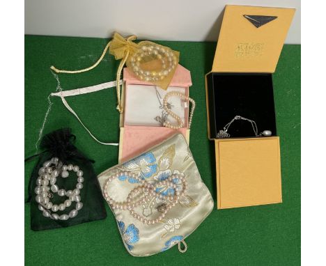A collection of various cultured and freshwater pearl jewellery including a single pearl pendant on 18 carat Italian white go