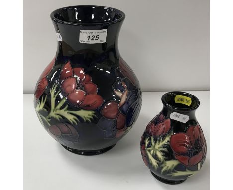 A Moorcroft "Anemone" blue ground baluster shaped vase, bearing impressed marks and copyright No. "34/94", 23 cm high, togeth