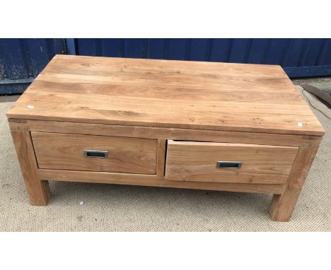 A Sheesham teak coffee table with two drawers on heavy square supports, 110 cm wide x 61 cm deep x 46 cm high, together with 