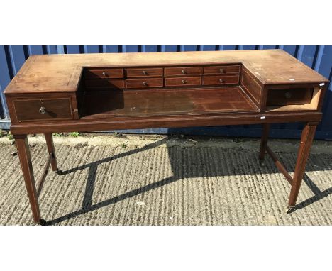 A 19th Century mahogany dressing table (square piano conversion), the top with recessed bank of eight drawers, flanked by two