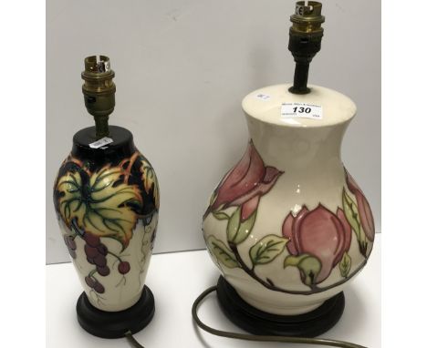 A Moorcroft "Grape and Vine" pattern baluster shaped vase table lamp, on a black stained socle base, bearing felt base with m