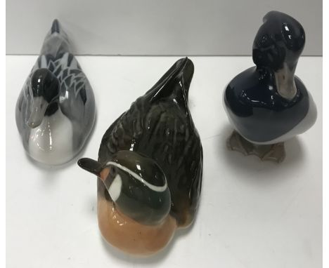 Two Royal Copenhagen ducks, one numbered 1041, the other 1933, together with a USSR Lomonosov Baikal duck and a set of six Ol