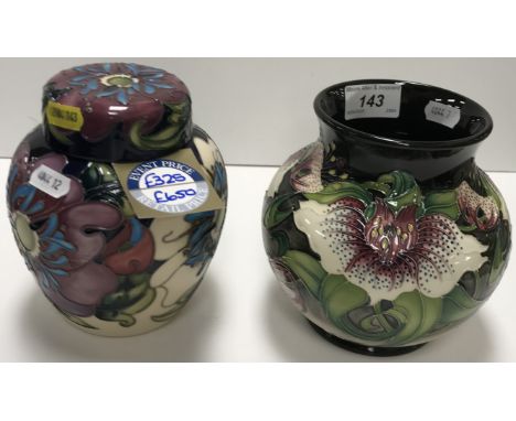 A Moorcroft "Anna Lily" vase in unusual colourway, on a black background, with white petals, by Nicola Slaney, dated "2009", 