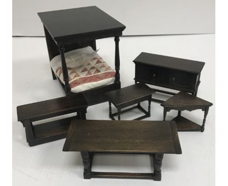 A collection of Norman Jones "Tudor Time" doll's house miniatures including corner table, four-poster bed, livery cupboard, d