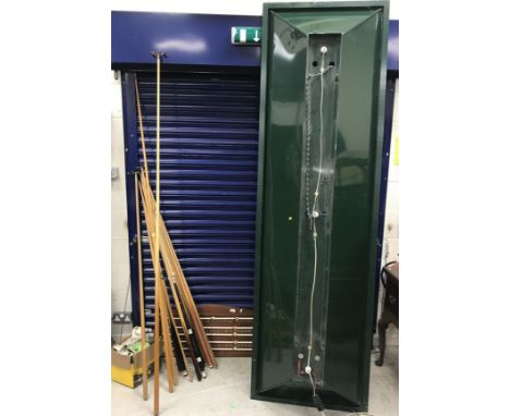 A collection of various snooker / billiards ephemera including scoreboard, green-painted metal light, seven various cues, inc