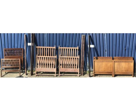 A Heal & Son mahogany single bedstead, 93 cm wide, a pair of mahogany blind fretwork decorated single bedsteads, 92 cm wide a