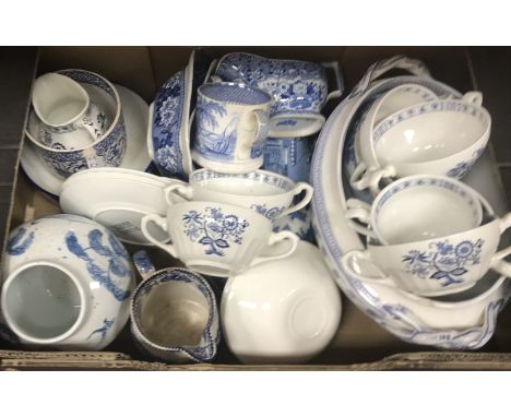 Four boxes of assorted decorative blue and white china wares to include serving plates, strainer, tureens, cups, saucers, etc