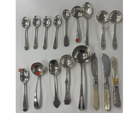 A collection of silver spoons to include sugar sifting spoon, a set of five teaspoons, various sauce ladles, etc. and two sil