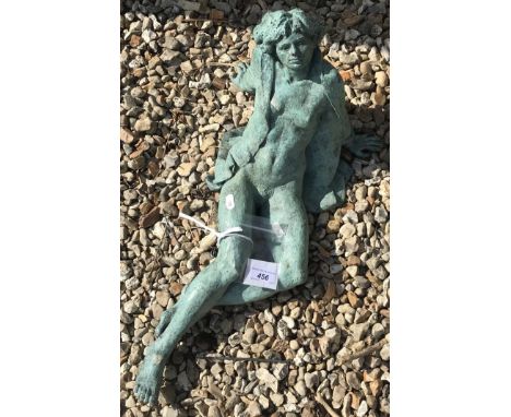 A bronze patinated seated female statue, 54 cm long x 27 cm wide CONDITION REPORTS Unable to see any stamp marks on it.  Has 