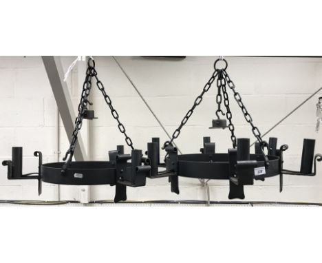 Two matching wrought iron electroliers (one six light and one three light), 40 cm diameter x 18 cm high and 35 cm diameter x 