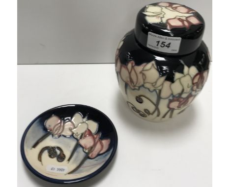 A Moorcroft "Wild Cyclamen" ginger jar and cover, impressed marks, date marked for "2005", bearing price tag "£197.50", 15.5 