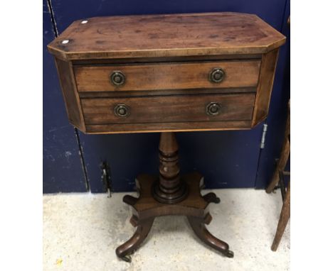 An early 19th Century mahogany worktable, the elongated octagonal top cross-banded over two frieze drawers, on a turned centr