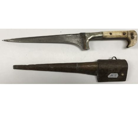 A 19th Century Yatagan dagger with shaped bone handle and tapering blade housed in a copper and steel covered scabbard, dagge