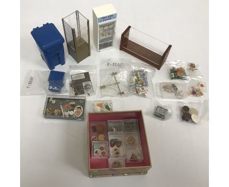 A collection of various modern doll's house shop items to include Miniature Dreams cakes, miniature food on plates, Christmas