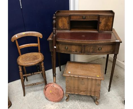 A Bevan Funnell mahogany ladies writing table with raised superstructure over a tooled and gilded writing surface and bow fro