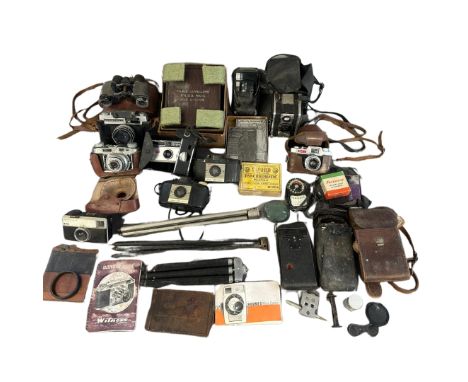 A collection of various cameras and accessories to include a Cee-ay 35, two Kodak folding cameras, two Brownie 127s, a Taron 