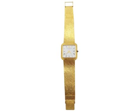 A Baume & Mercier gentleman's 18ct gold manual wind wristwatch on a 18ct gold bracelet hallmarked 750 and with Head of Helvet