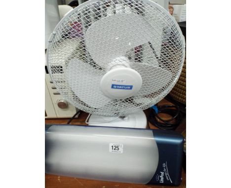 A small oil filled electric radiator, an oscillating fan and a Light Pod light