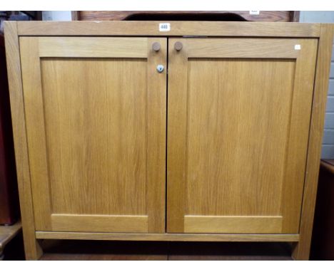 A modern light oak two door cupboard 3'6 wide