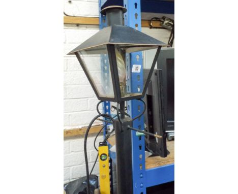 Metal six foot tall lamp post style outdoor light 