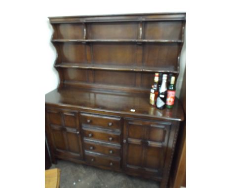 An Ercol oak Welsh style dresser with drawers and cupboards under (matches Lot 430) 
