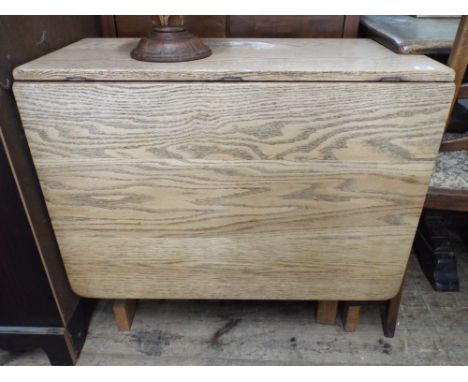 A light oak gate leg dining table approx 2'6" wide